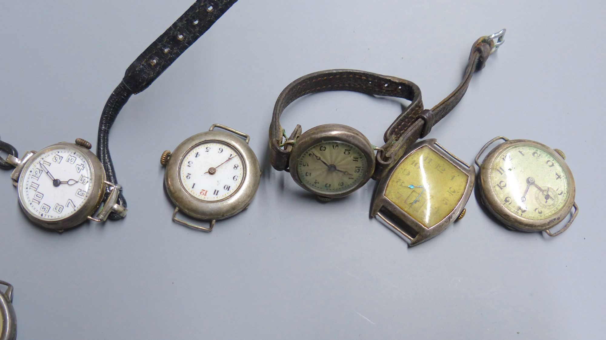 Eight assorted early to mid 20th century silver and white metal wrist watches (a.f.).